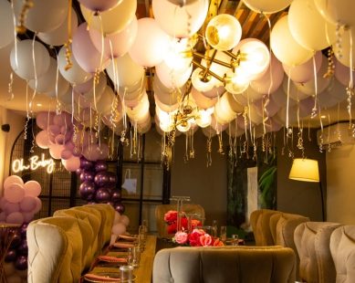 Balloon-decorated lounge for a surprise proposal