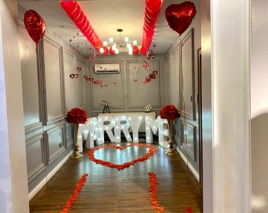 Hallway styled with Marry Me letters and petals
